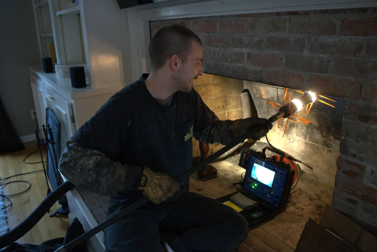 Chimney sweeping and camera inspection to remove creosote